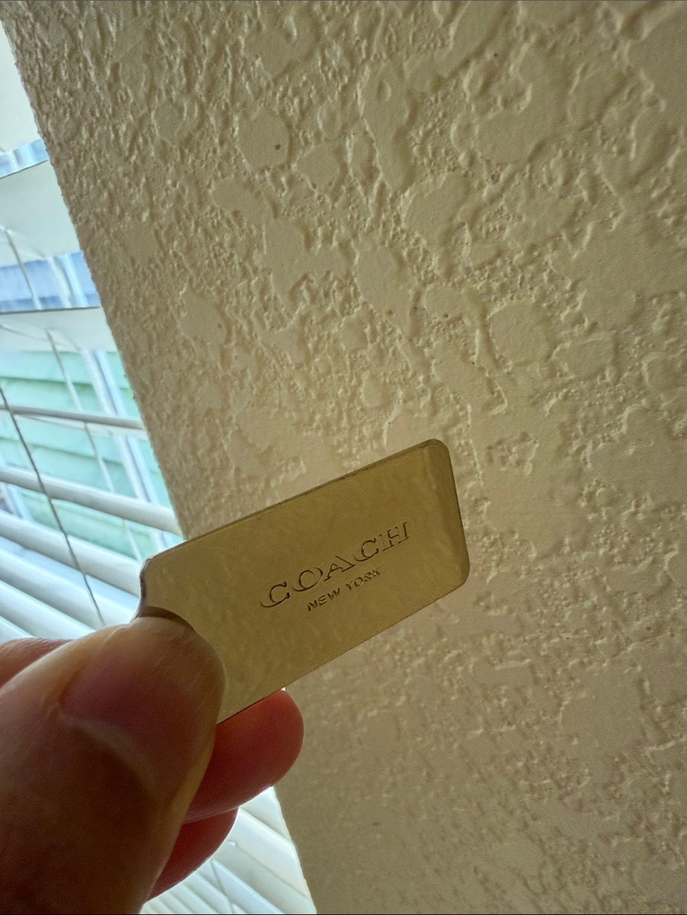 COACH Gold Metal Tag Accent